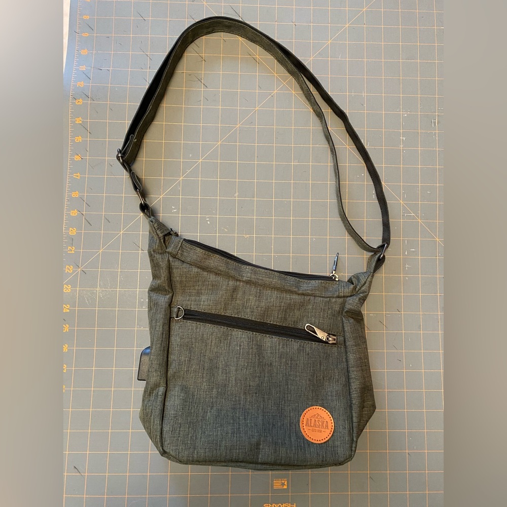 NuPouch Anti-theft crossbody with USB, NWOT